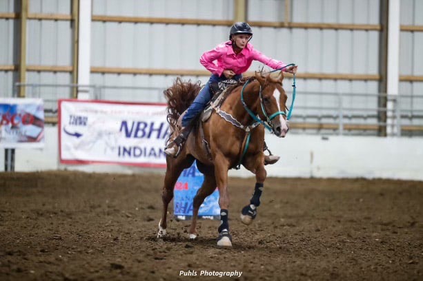 Leah Probst rounds a barrel and lets her horse run at the NBHA show in Edinburgh.